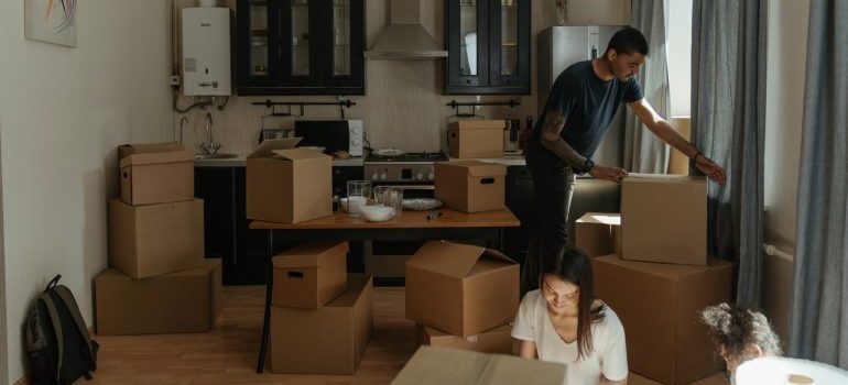 Man emptying boxes after learning how to make the unpacking process fun