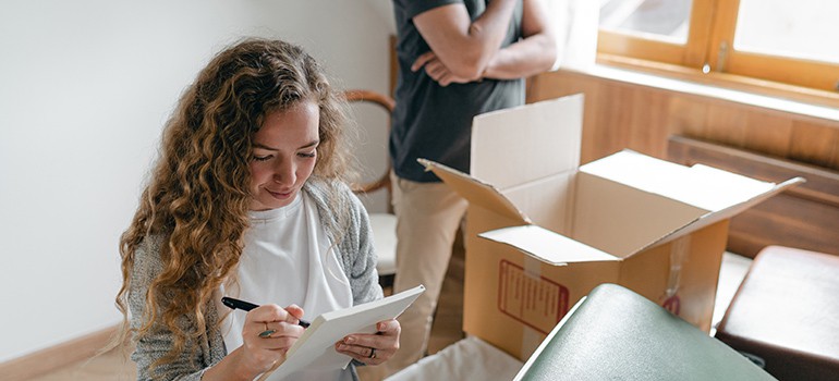 woman going over moving checklist
