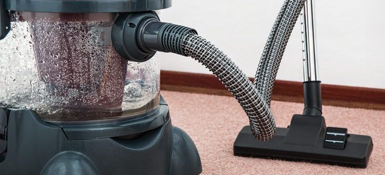 A vacuum cleaner on the floor.