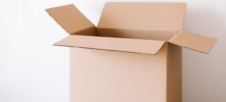 Pack and move books in cardboard boxes