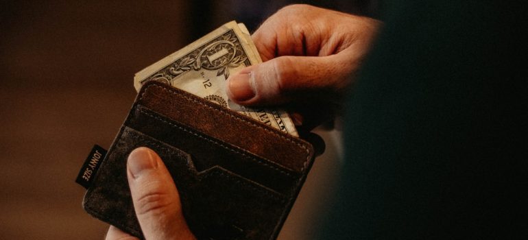 A man paying something from his wallet