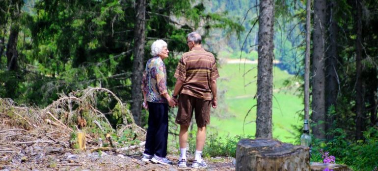 an elderly couple standing in nature in one of the best Delaware suburbs for seniors